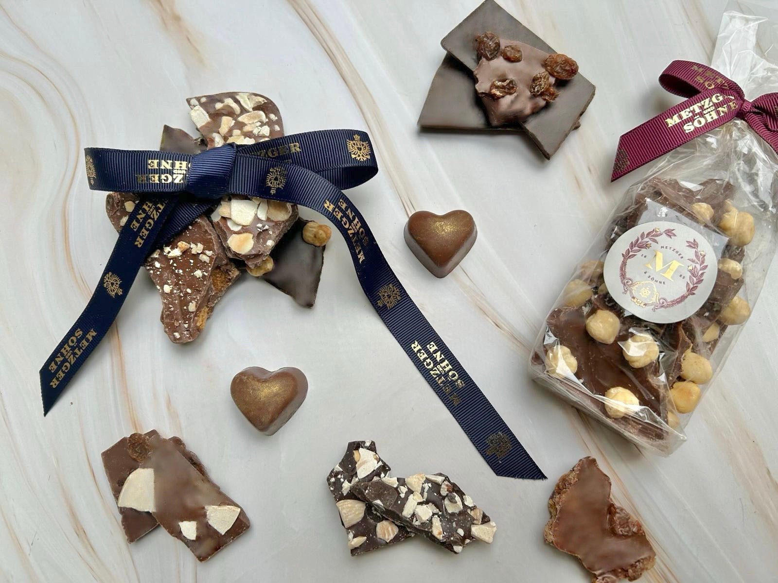 Edel Vollmilch Schokolade (42%) mit NUSS-RUM Bruch